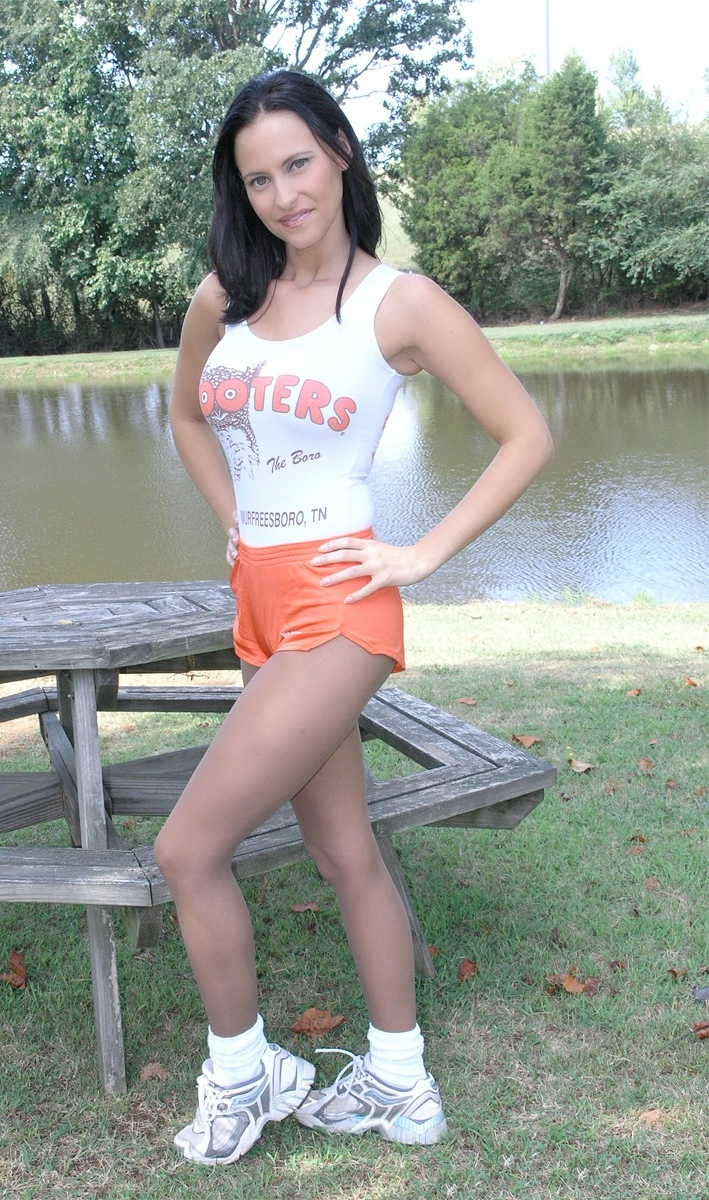 Brunette Hooters Waitress wearing Grey Sheer Pantyhose and White Sneakers